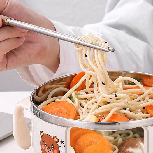 Instant noodle kawaii ramen bowl with noodles and vegetables, held by a person using chopsticks.