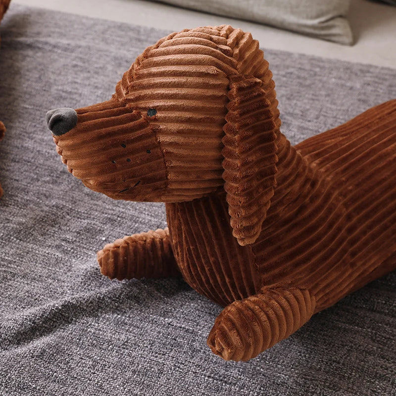 Brown corduroy dog kawaii toy on a textured surface