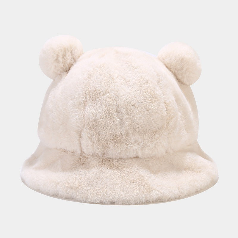 White fluffy Kawaii hat with two pom-poms on a light gray background