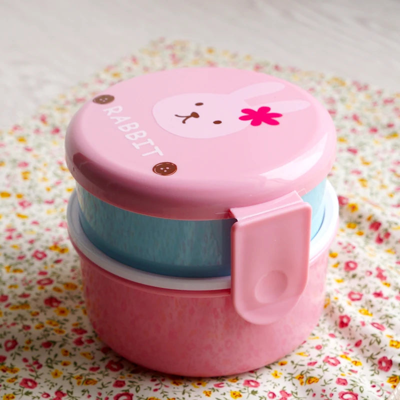 Pink and blue kawaii snack container with a rabbit design on a floral background