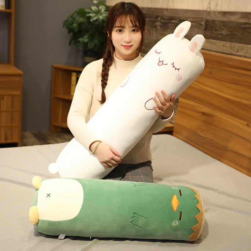 Person holding a large, cartoonish kawaii plush toy on a bed.