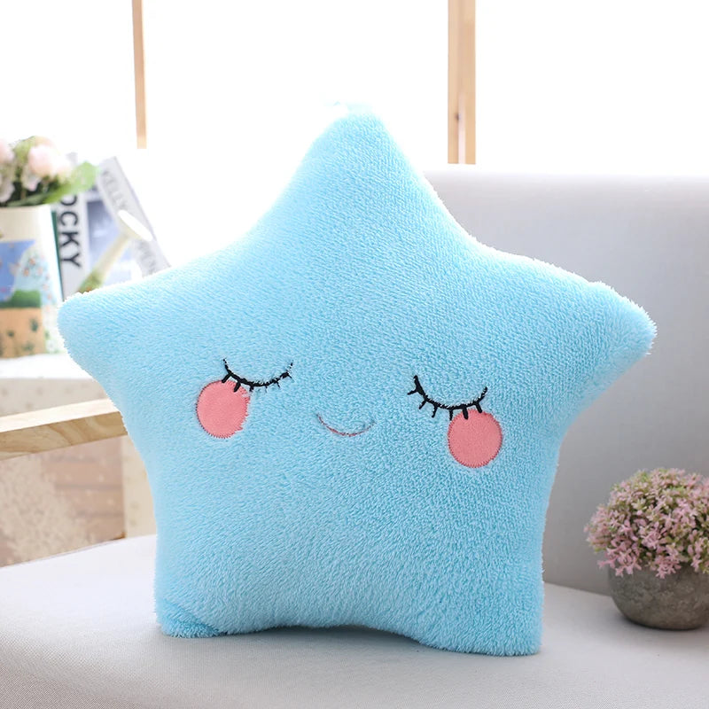 Star-shaped kawaii pillow with a smiling face on a couch