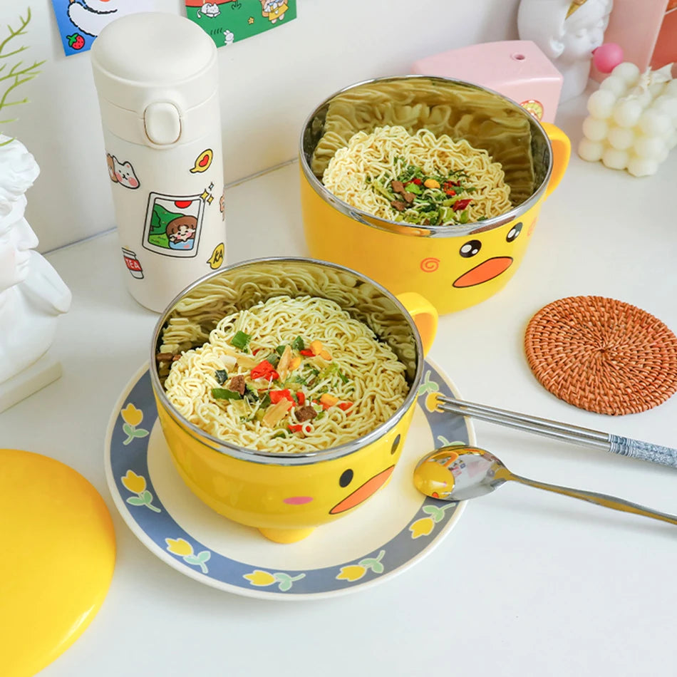 Two duck themed kawaii ramen bowls sitting on a table