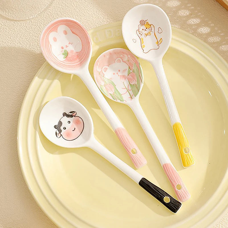A set of four kawaii spoons on a dinner plate
