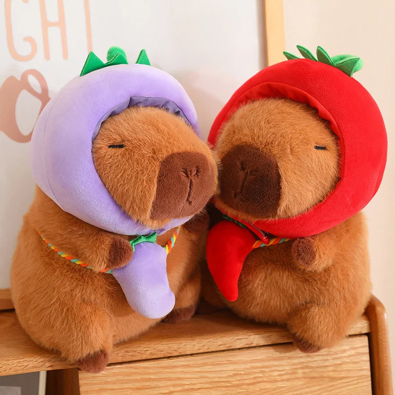 Two kawaii plush toys resembling dogs with fruit hats on a wooden surface.