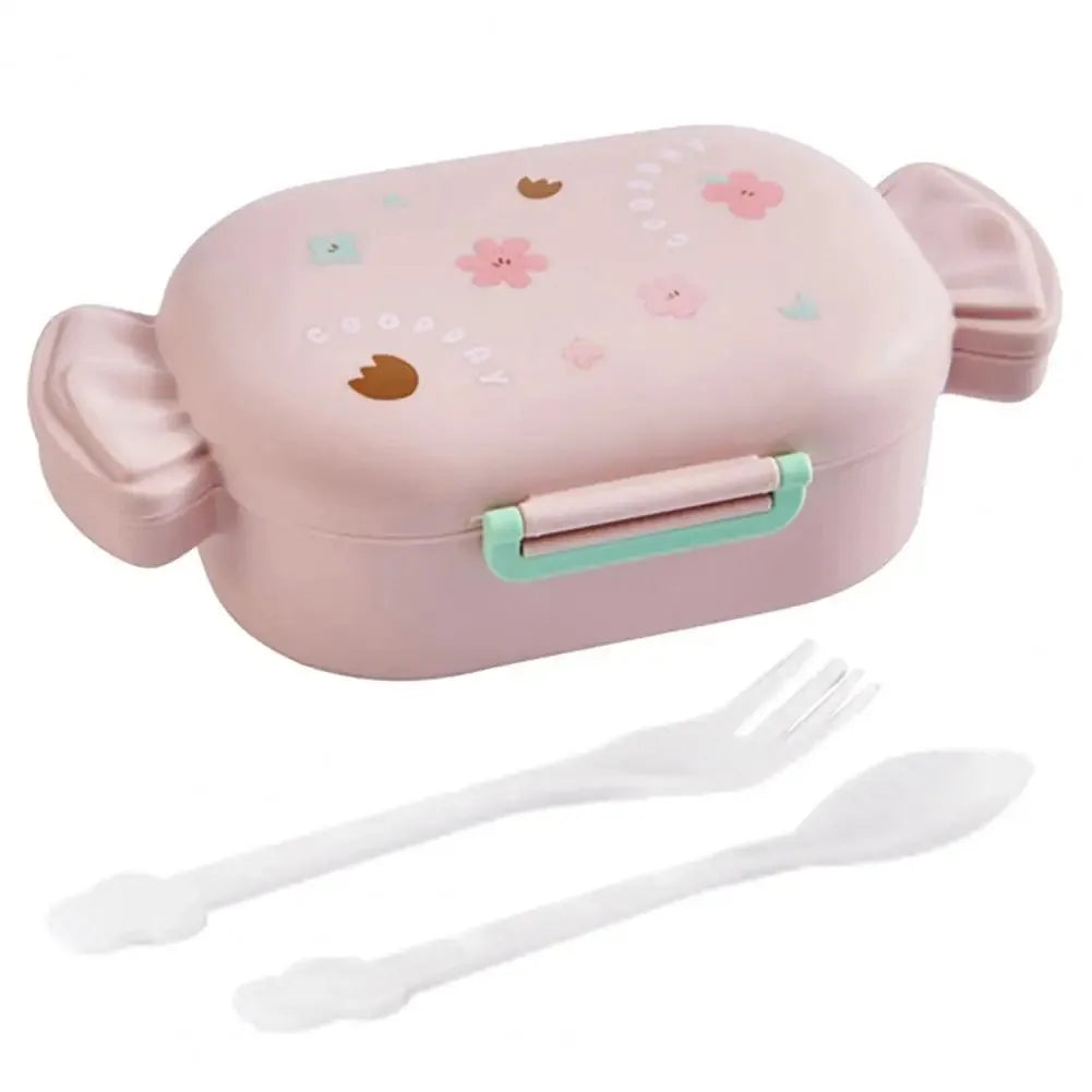 Pink cartoon-style kawaii lunch box with floral designs and a fork and spoon on a white background