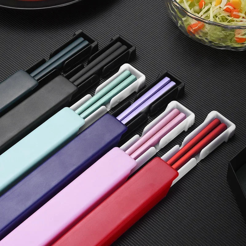 Colorful sets of kawaii chopsticks in their holders on a dark surface.