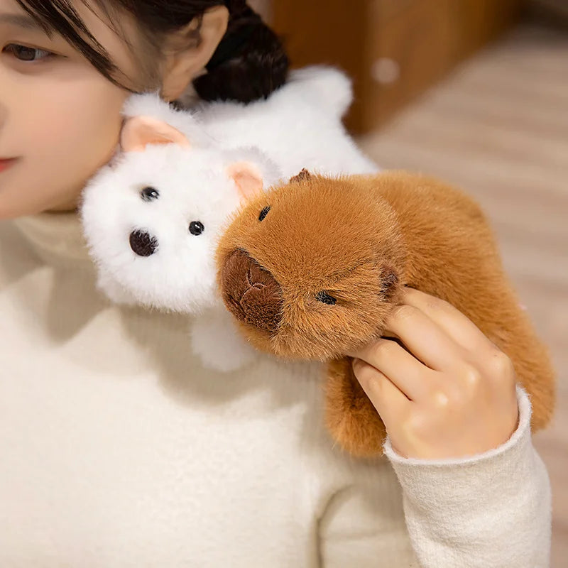 Person holding a white and brown kawaii plush toy resembling a dog and a bear.