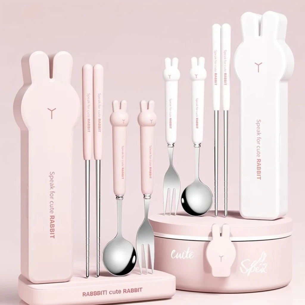 Cute rabbit-themed kawaii utensils set with pink handles on a light pink background