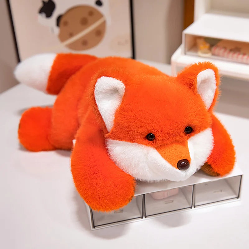 Kawaii plush fox toy on a white surface with a neutral background