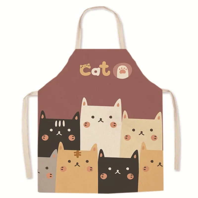 Children's kawaii apron with cartoon cat designs on a brown background