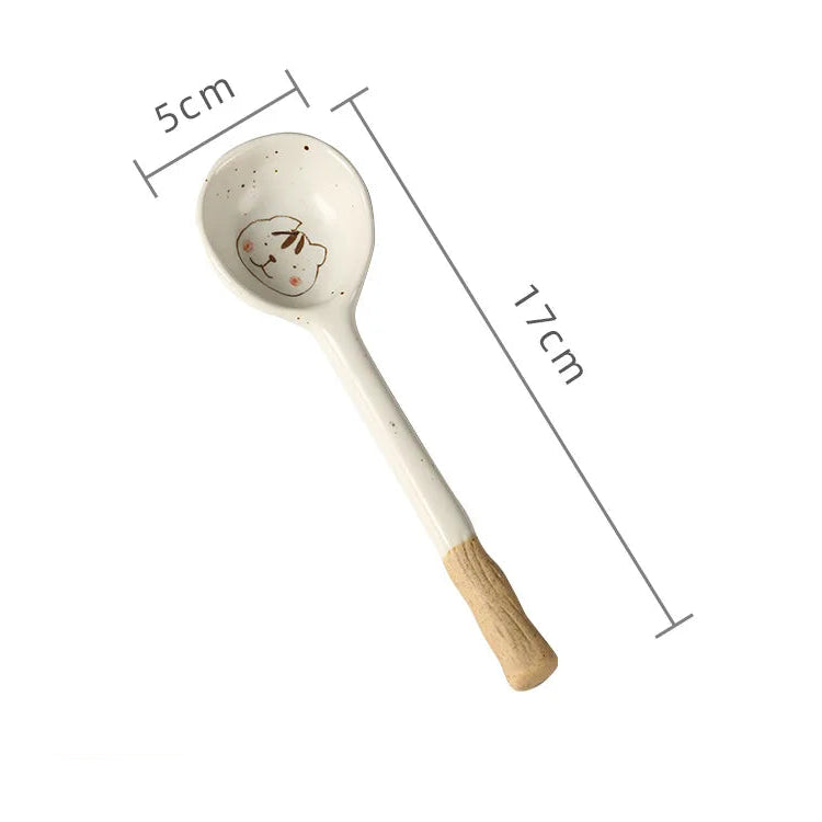 A white ceramic kawaii spoon with measurements