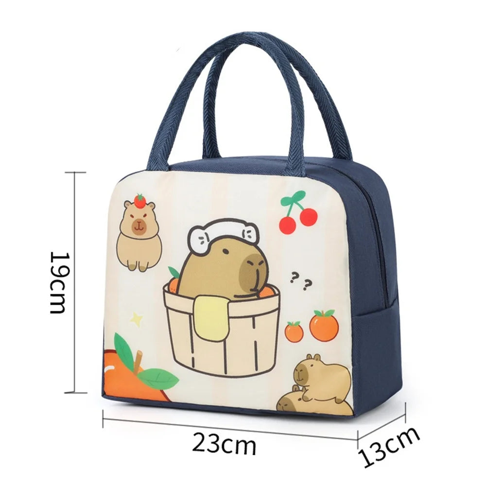 Navy blue kawaii lunch bag with cartoon design and measurements on a white background