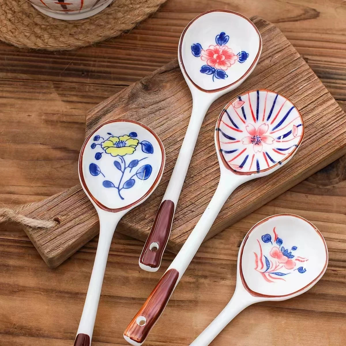 Four white ceramic kawaii spoons on the table