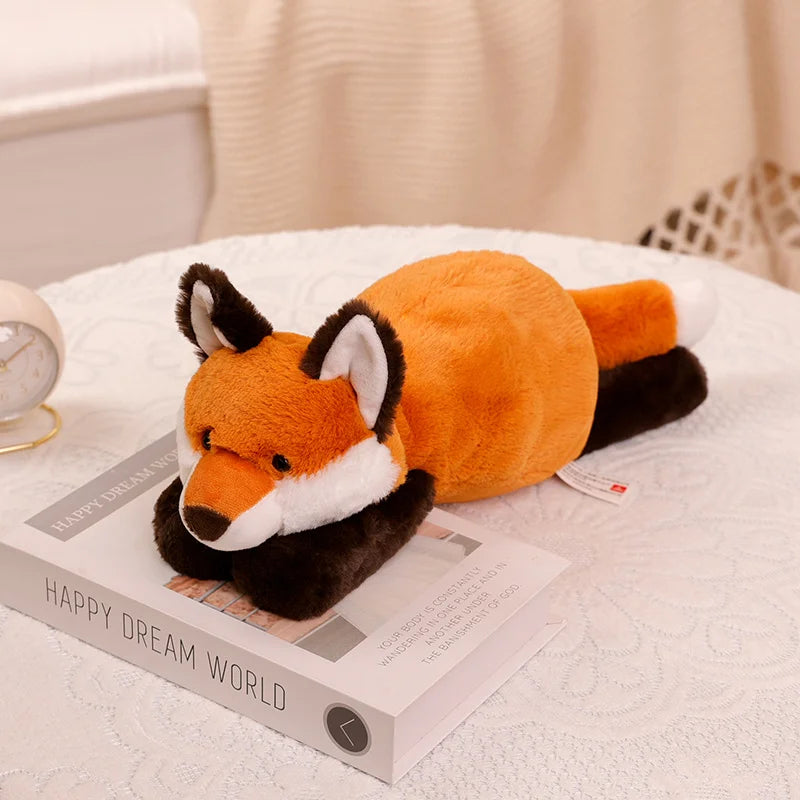 Kawaii plush fox toy on a book with a soft background