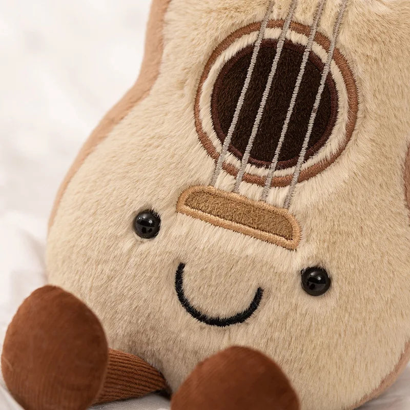 Kawaii plush toy guitar with a smiling face on a white background