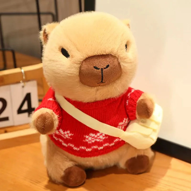 Kawaii plush toy bear wearing a red sweater with white patterns on a wooden surface.