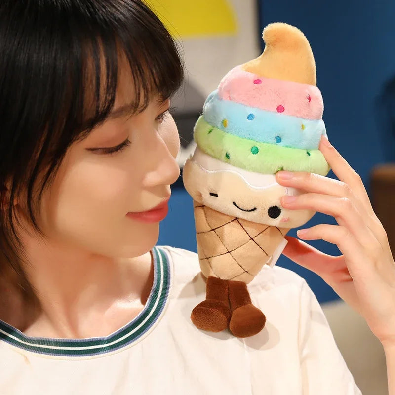 Person holding a kawaii plush toy ice cream cone with rainbow-colored scoop