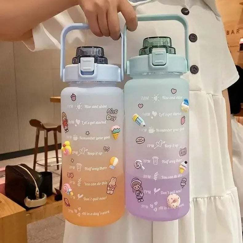 Two colorful kawaii water bottles with cartoon designs held by a person in a white outfit.