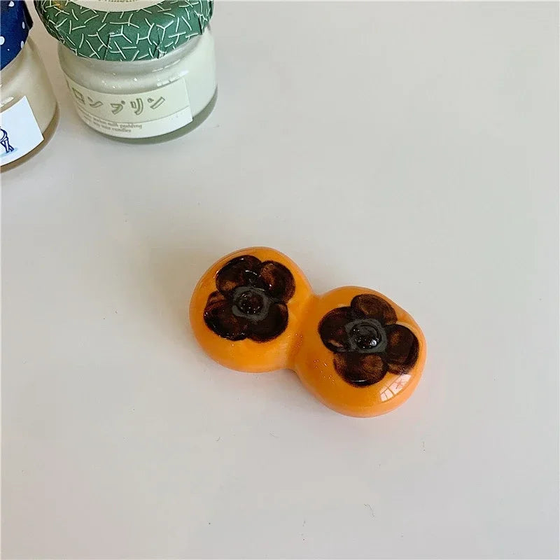 An orange shaped kawaii chopstick holder