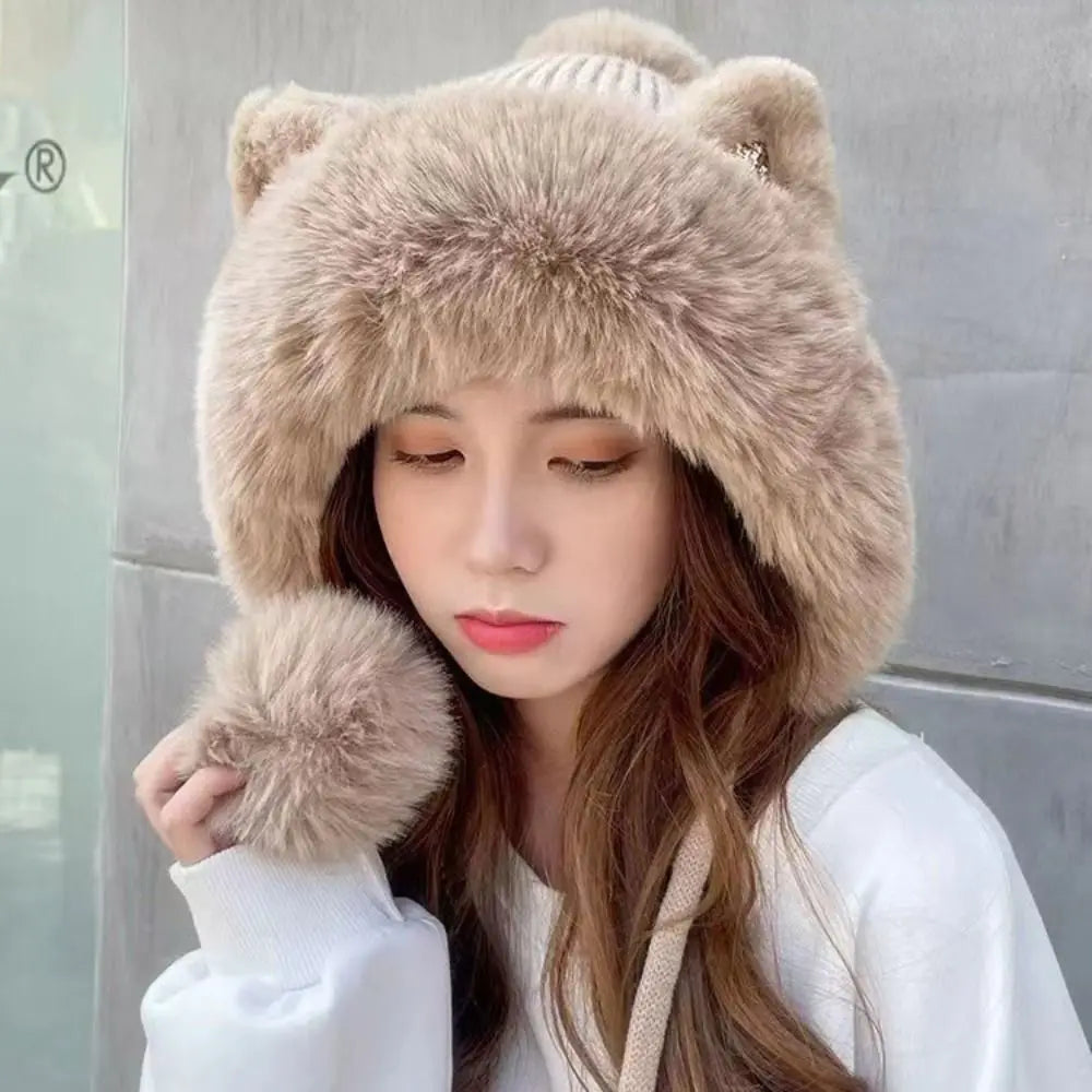 Woman wearing a beige fur hat with Kawaii bear ears and matching gloves against a light gray background