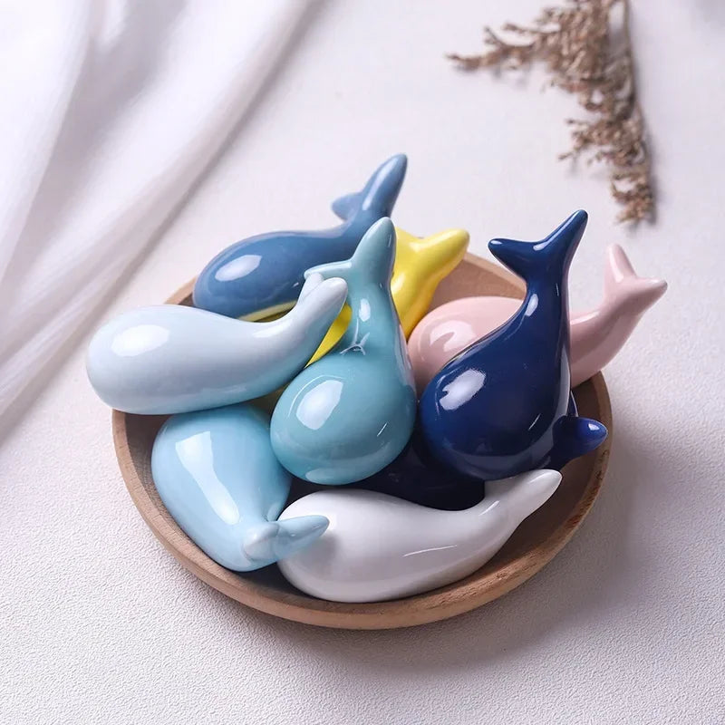 A set of multicolored whale shaped kawaii chopstick holder