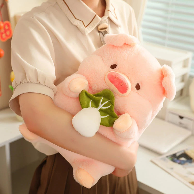 Person holding a kawaii plush toy pig with a leaf in a casual indoor setting