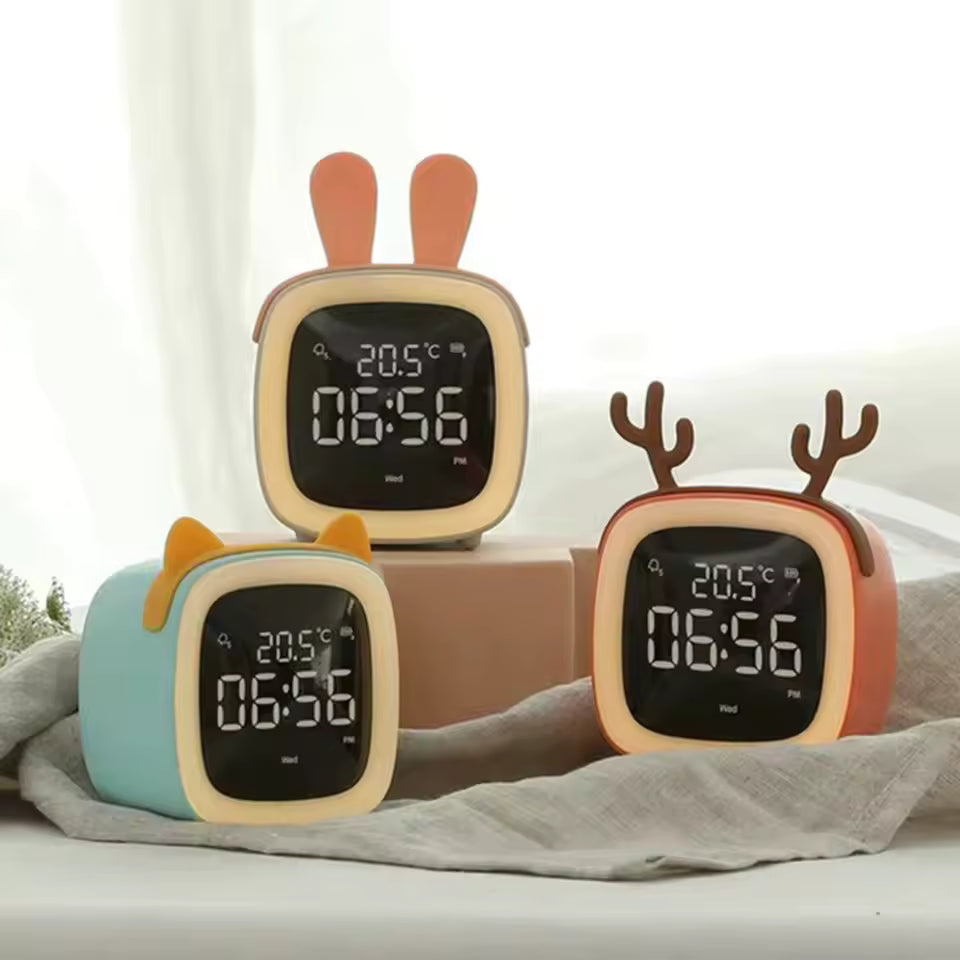 Three cartoon-style kawaii digital clocks with animal ears on a light background