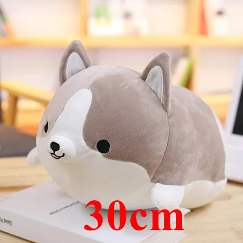 Plush kawaii toy dog on a book with '30cm' text, blurred indoor background