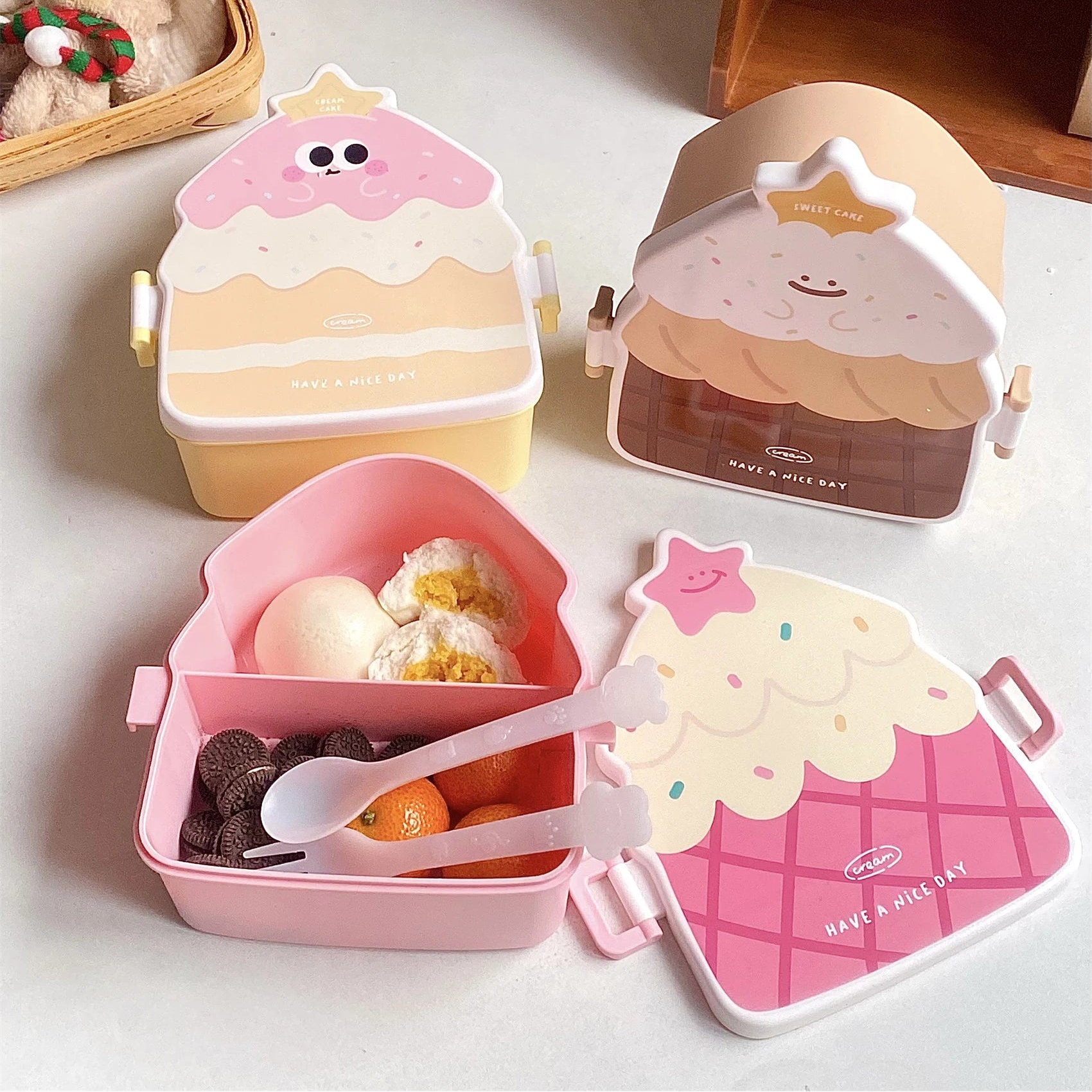 Set of cute cartoon-style kawaii bento boxes on a white surface with a wooden shelf in the background.