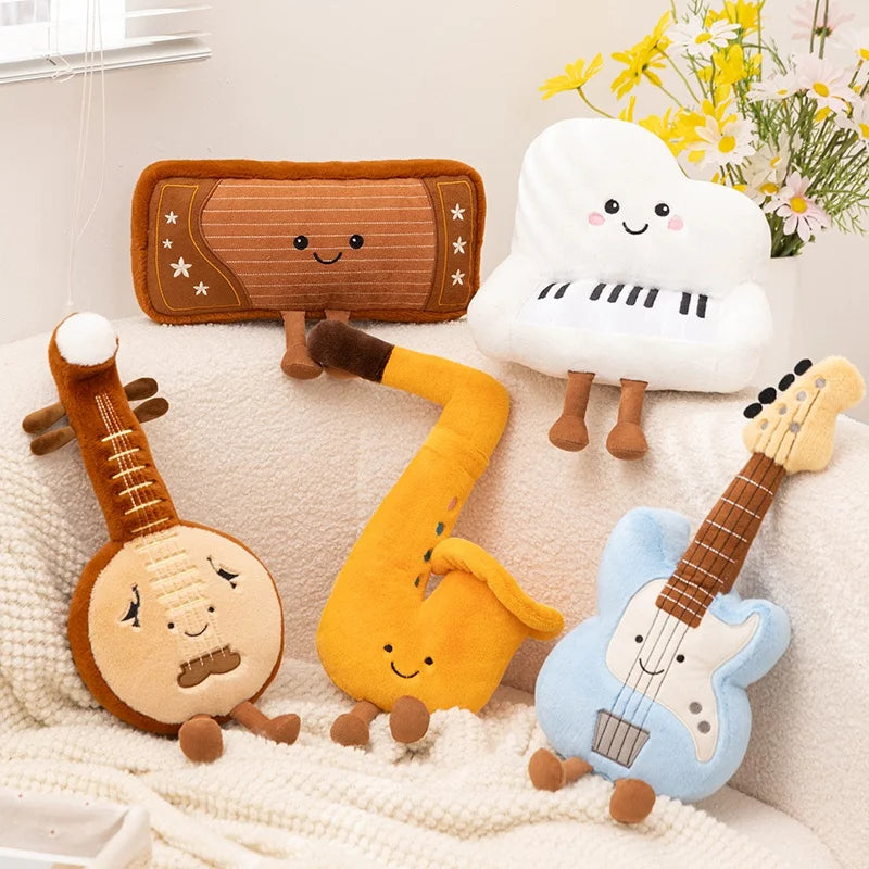 Set of kawaii plush toys shaped like musical instruments on a soft surface with flowers in the background.