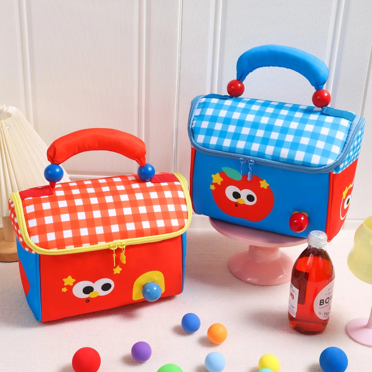 Two colorful children's kawaii bags with cartoon face designs on a light background.