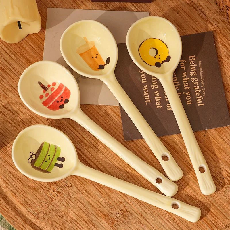 Four cartoon designed kawaii spoons on a kitchen table