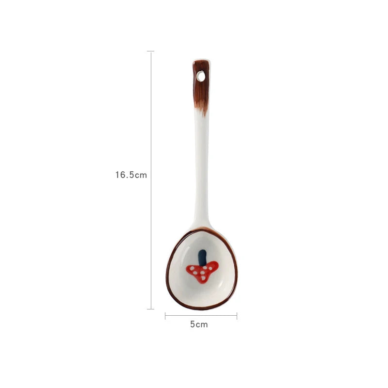 A mushroom designed white ceramic kawaii spoon on a white background
