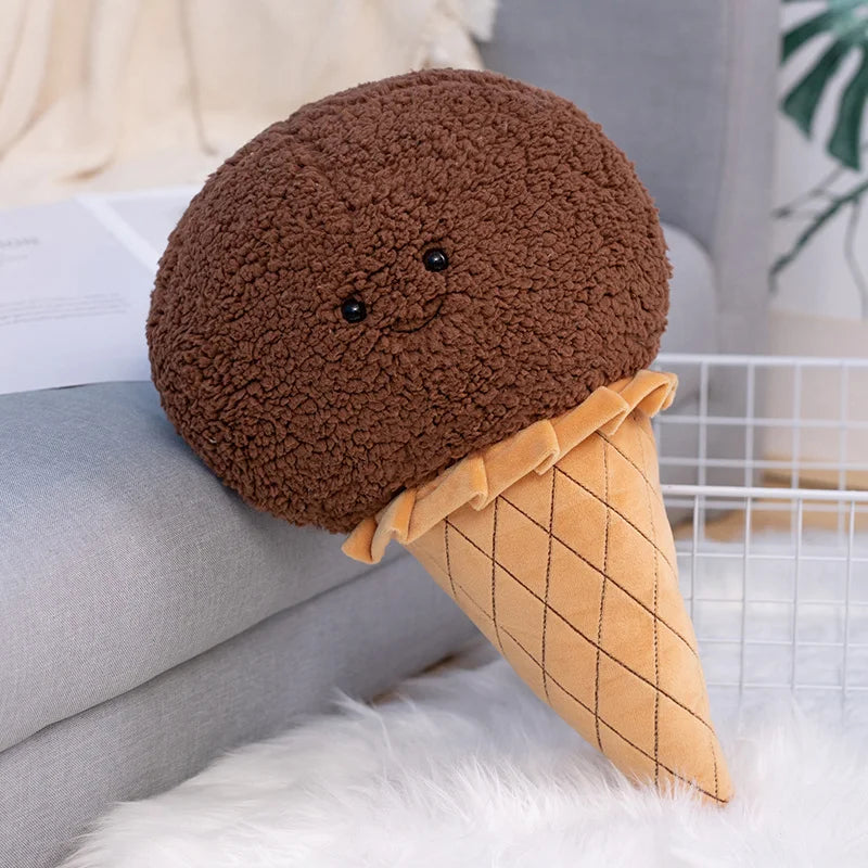 Kawaii plush toy resembling a chocolate ice cream cone on a couch