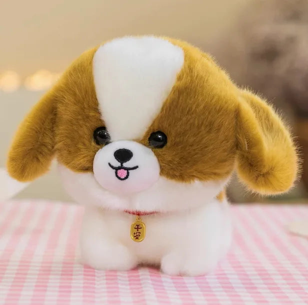 Kawaii plush dog toy with a white face and brown ears on a pink checkered blanket.