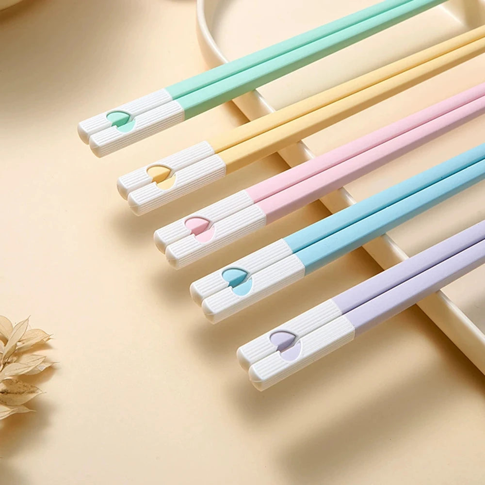 Set of colorful kawaii chopsticks on a light background