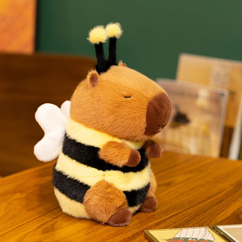 Kawaii plush toy bee on a wooden table with a blurred background