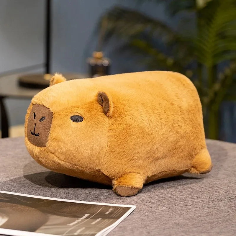Kawaii plush toy resembling a bear on a table with a blurred background