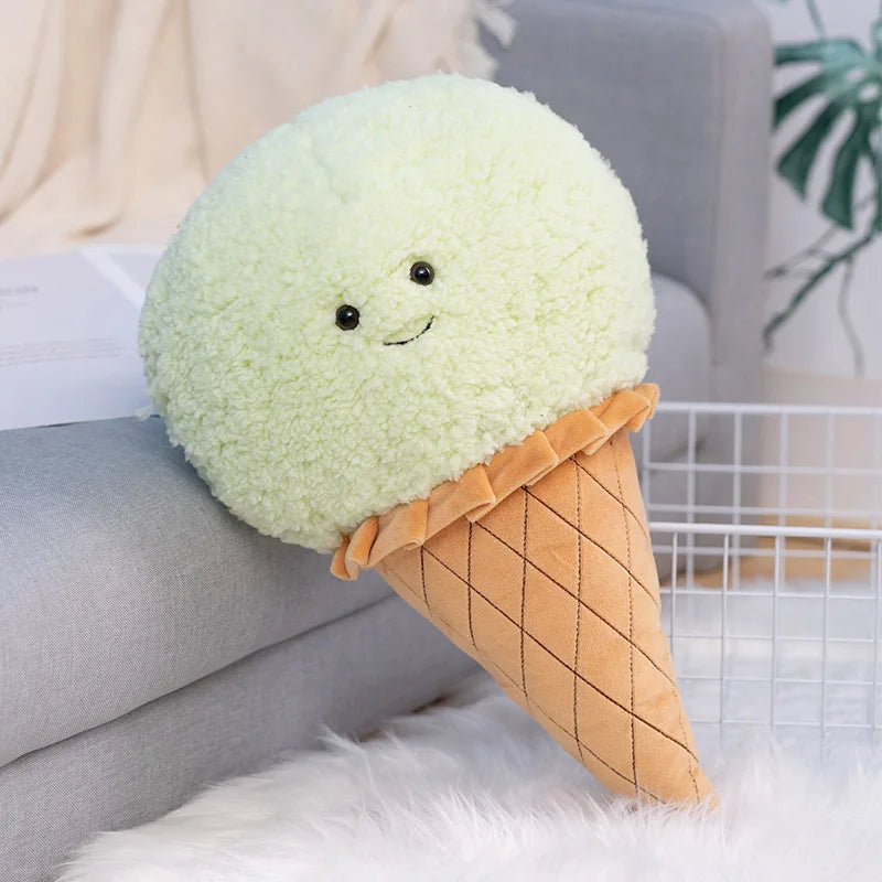 Kawaii plush toy shaped like a scoop of ice cream with a smiling face on a couch.