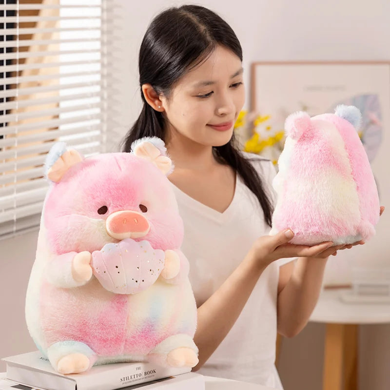 A woman holding a kawaii rainbow pig plush toy