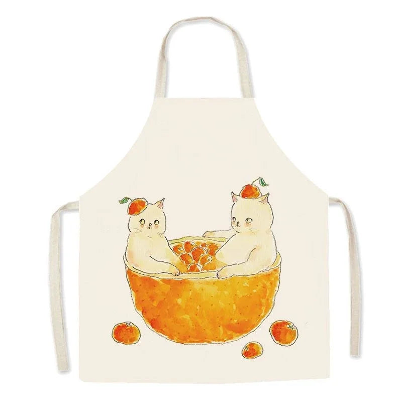 Kawaii apron with a design of two cats in an orange bowl on a white background