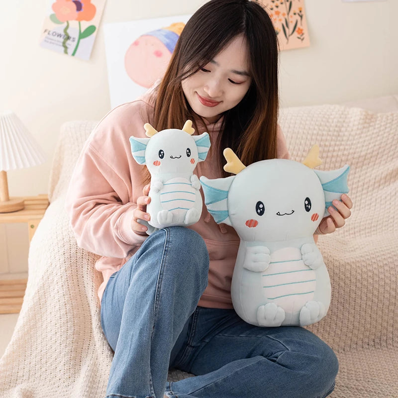 Woman holding two cute kawaii plush toys in a cozy living room.