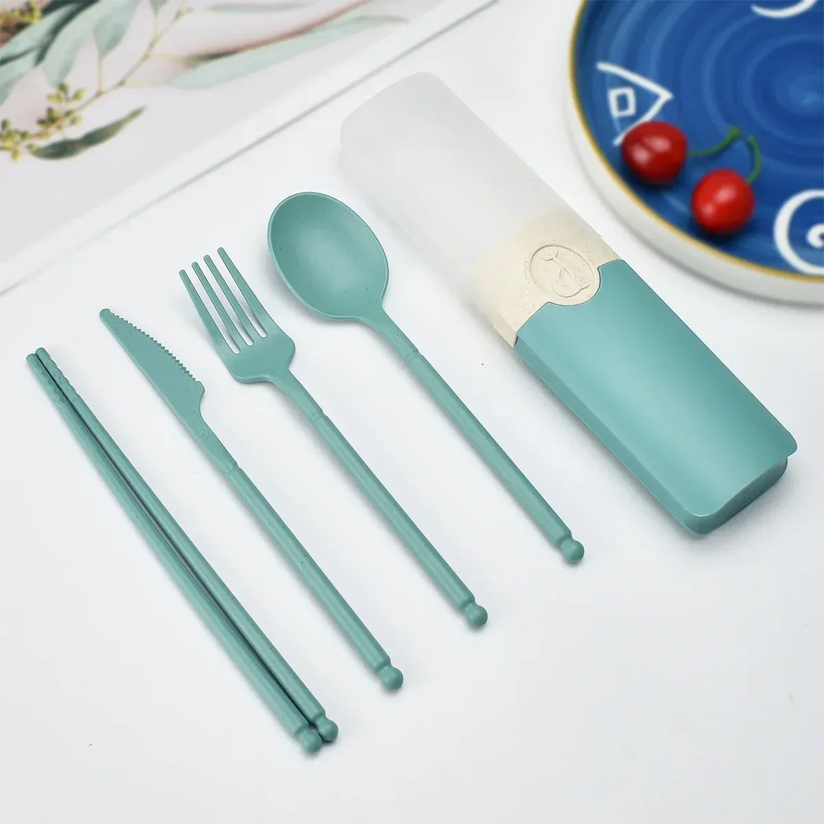 Teal kawaii utensils set with case on a light surface
