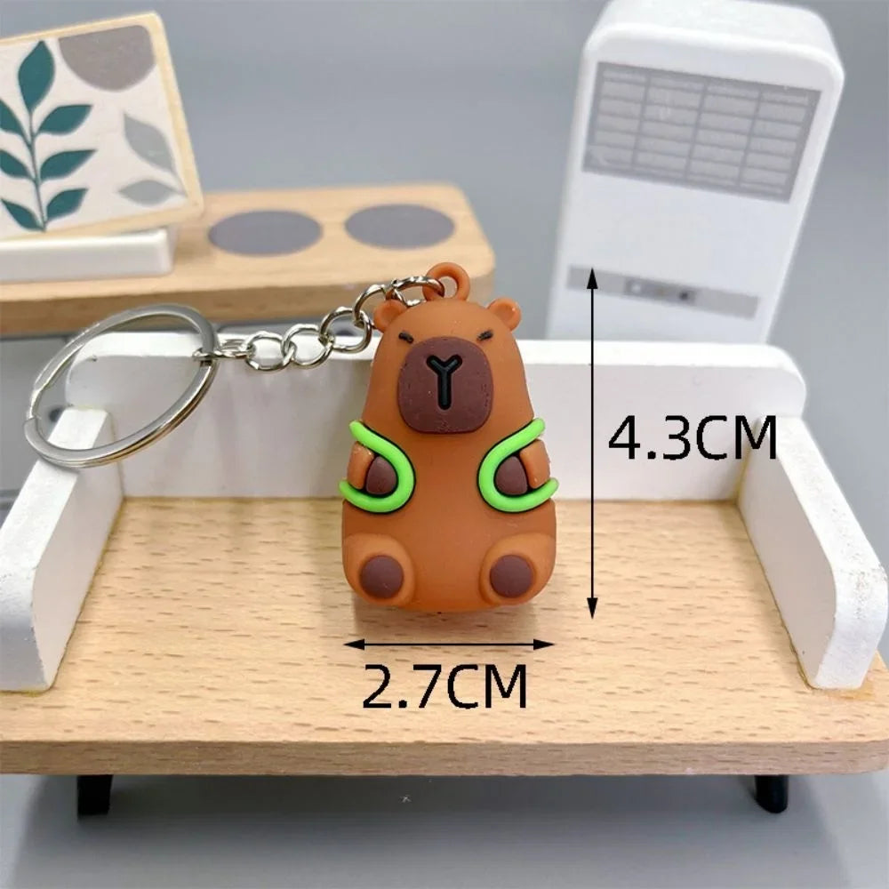 Keychain with kawaii bear design on a wooden surface with measurements indicated