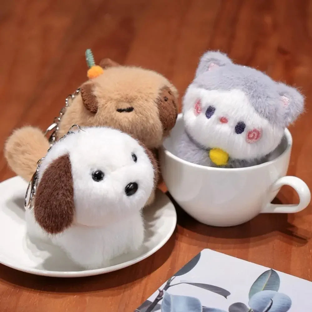 Three kawaii plush dog toys on a wooden surface with a cup and saucer.