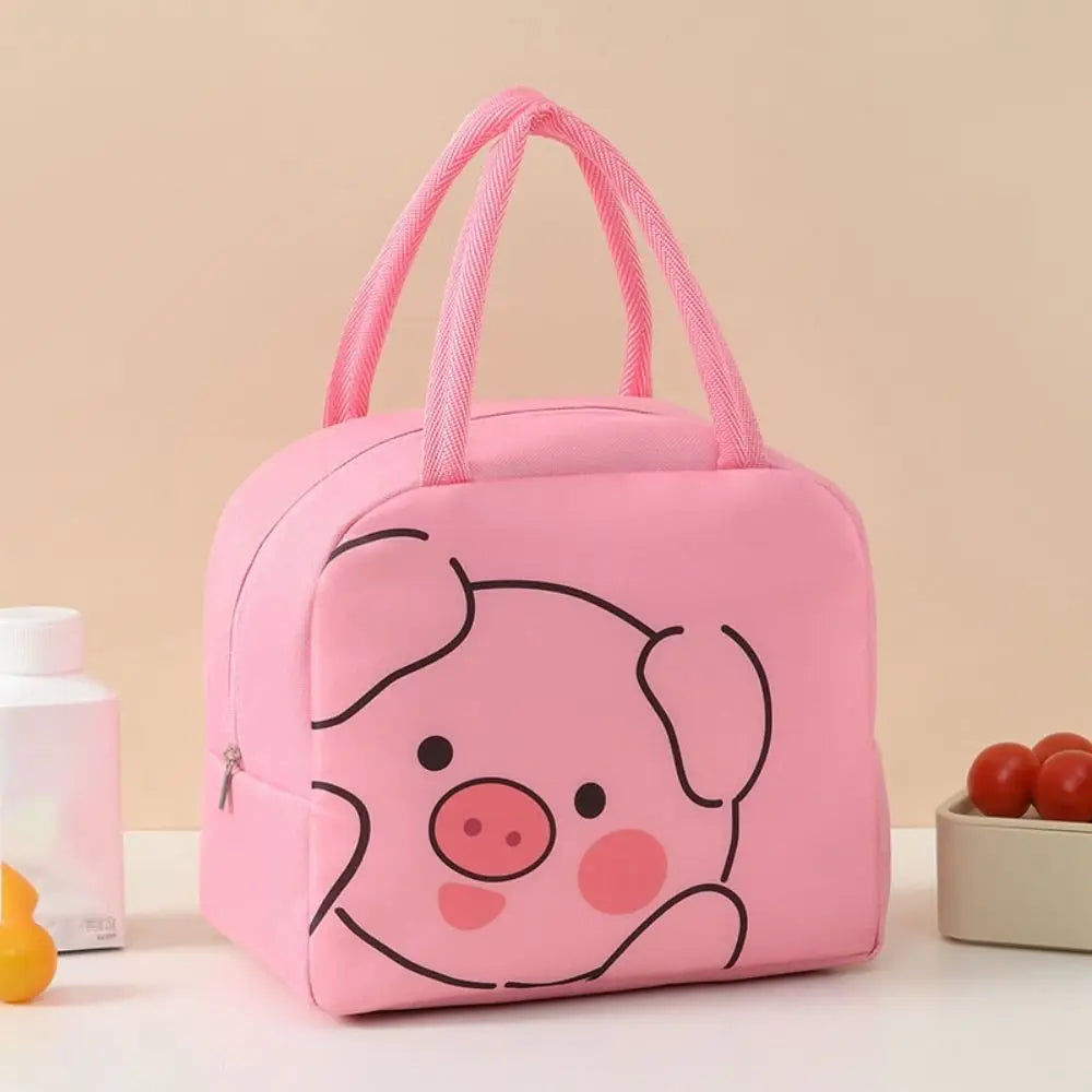 Pink kawaii lunch bag with a pig design on a beige background