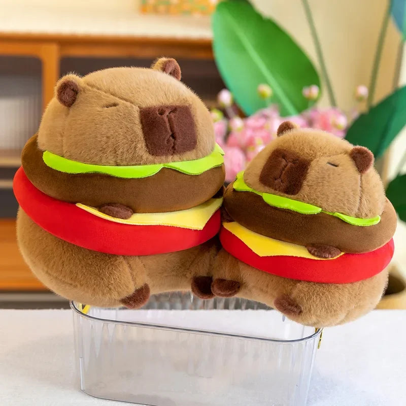 Two kawaii brown bear-shaped hamburgers with a clear container in the foreground.