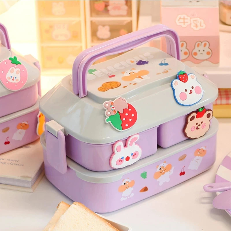 Kawaii-themed bento box with cartoon characters on a light background