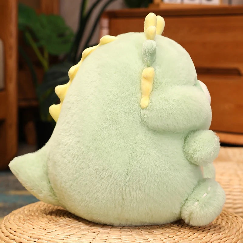 Plush kawaii dinosaur toy on a woven mat with a blurred indoor background